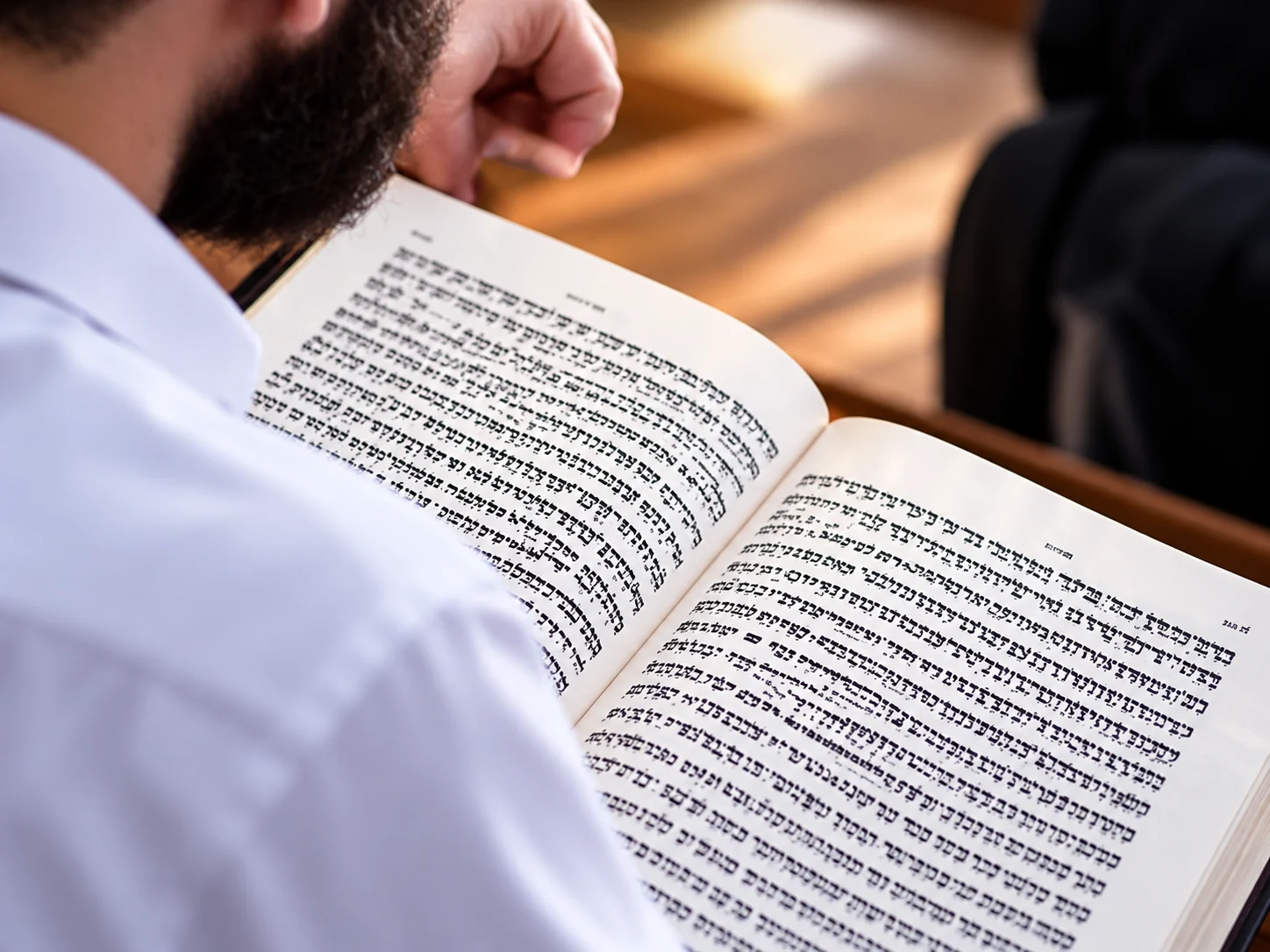 AI-generated illustration of a person studying a Hebrew-language religious book